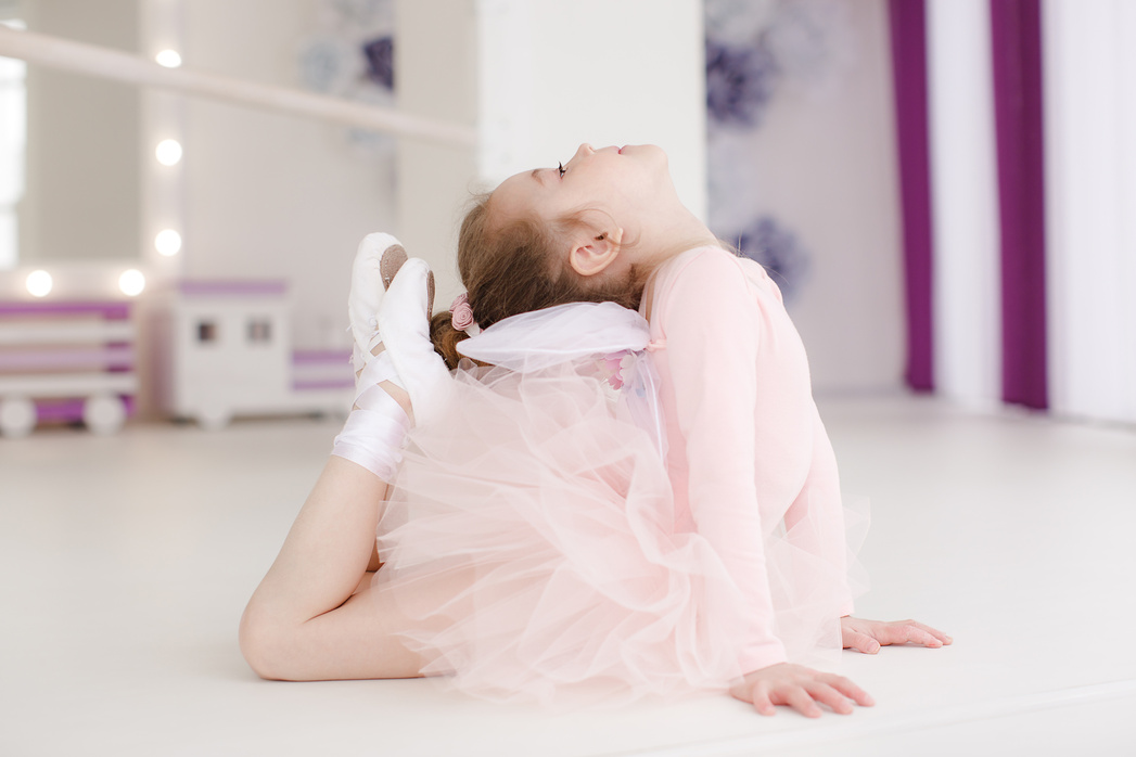 Little cute girl in class in ballet studio